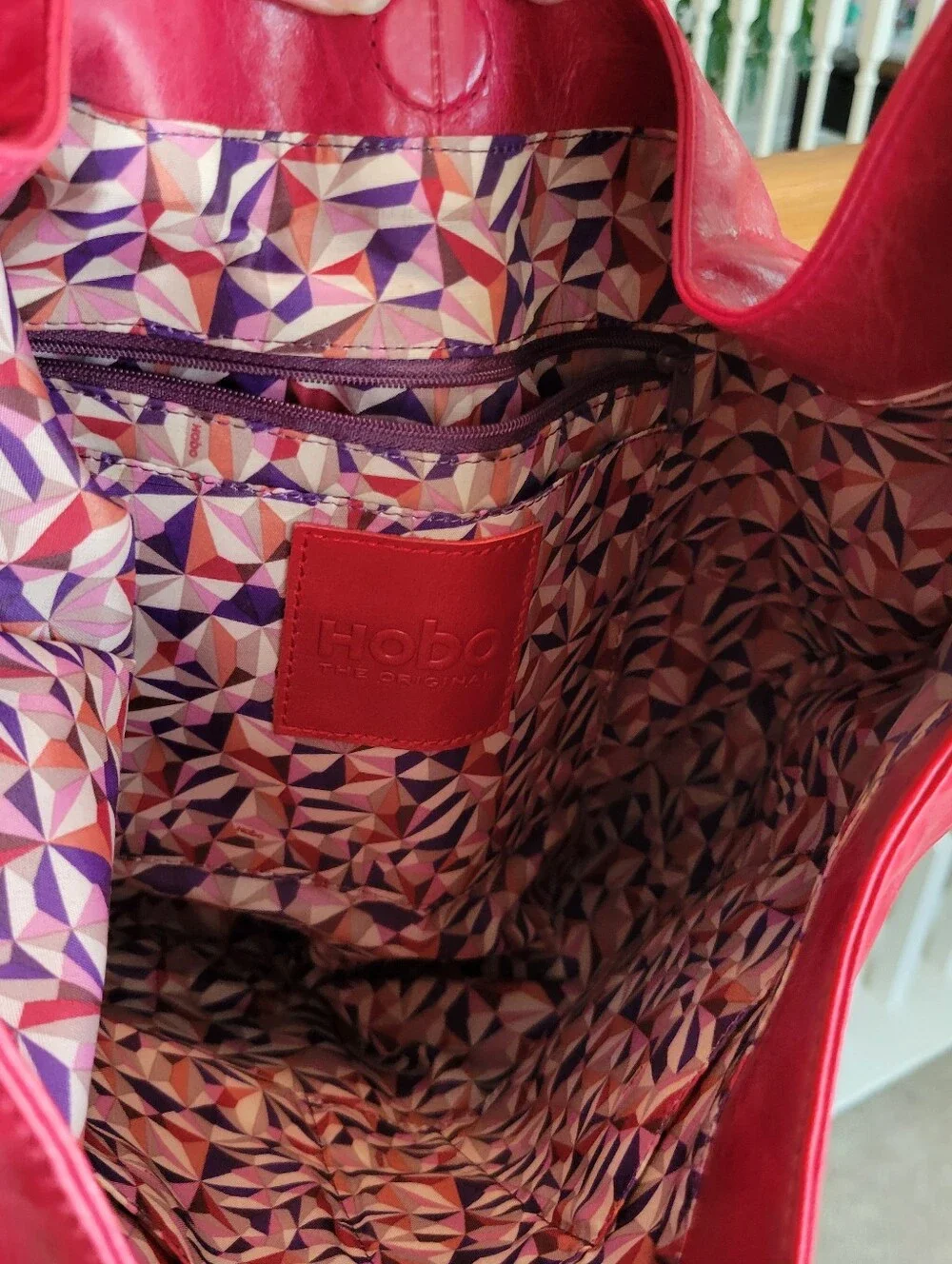 Hobo Women's Red Leather Shoulder Bag With 1 Strap, and Magnetic Close.